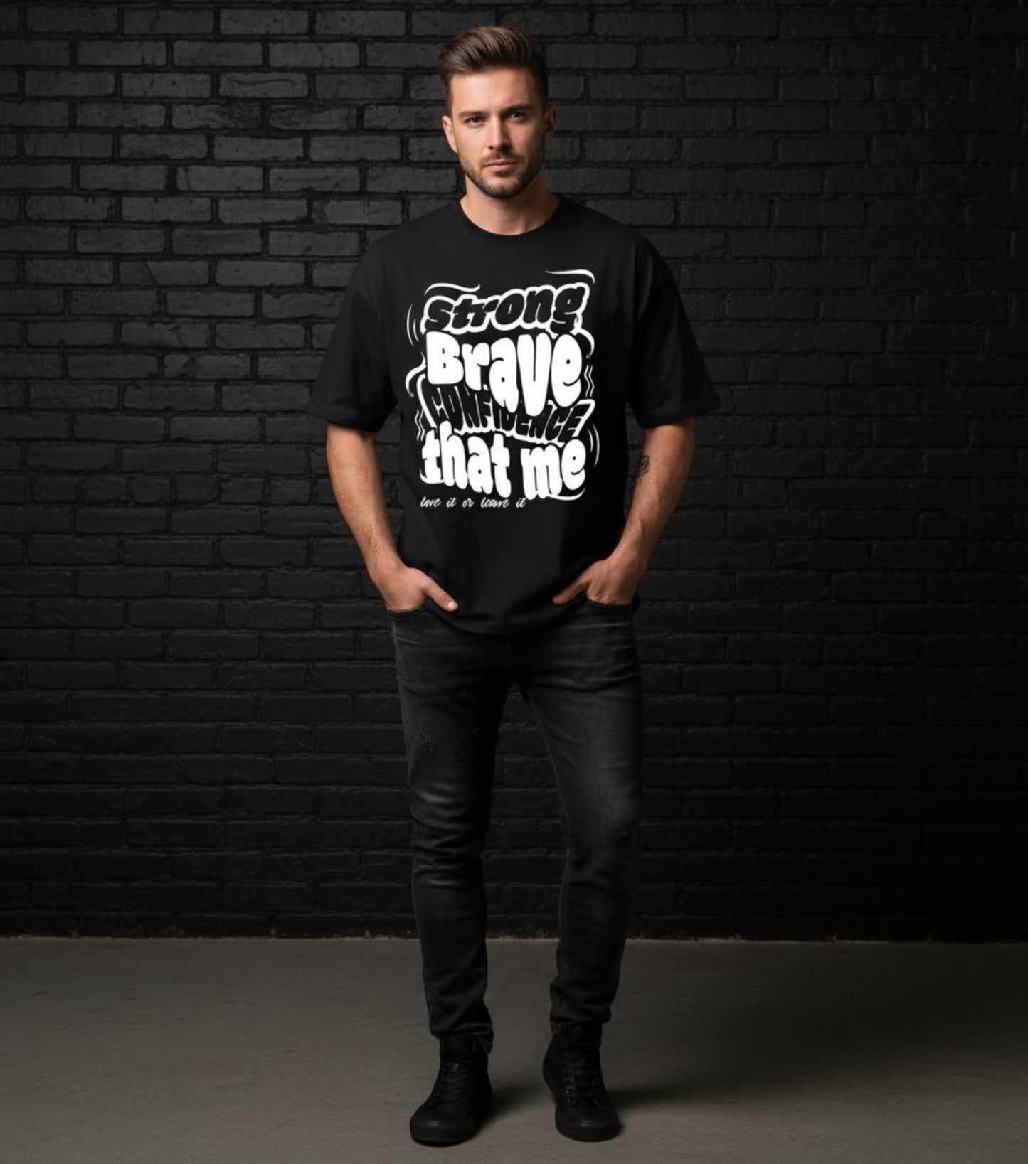 Man wearing a black t-shirt with white text against a dark brick wall.